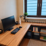 Wooden corner desk with shelves for a programmer working at a computer