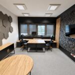 A large office workstation for two employees, featuring corner desks and a filing cabinet
