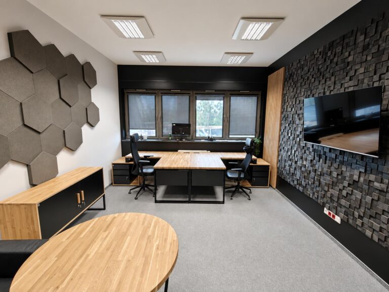 A large office workstation for two employees, featuring corner desks and a filing cabinet