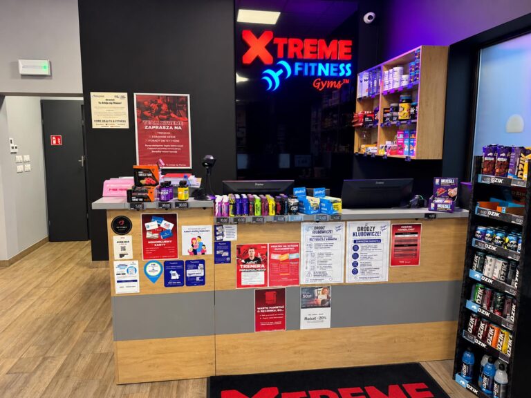 A reception desk made of furniture board with cabinets for the gym's break room