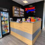 A reception desk made of furniture board with gray accents for the Xtreme Fitness club