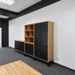 Minimalist office furniture featuring a bookcase, a chest of drawers, and a tall cabinet