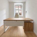 A modern corner desk with a storage unit for documents and a computer