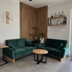 A lounge area with a wooden coffee table and a side table
